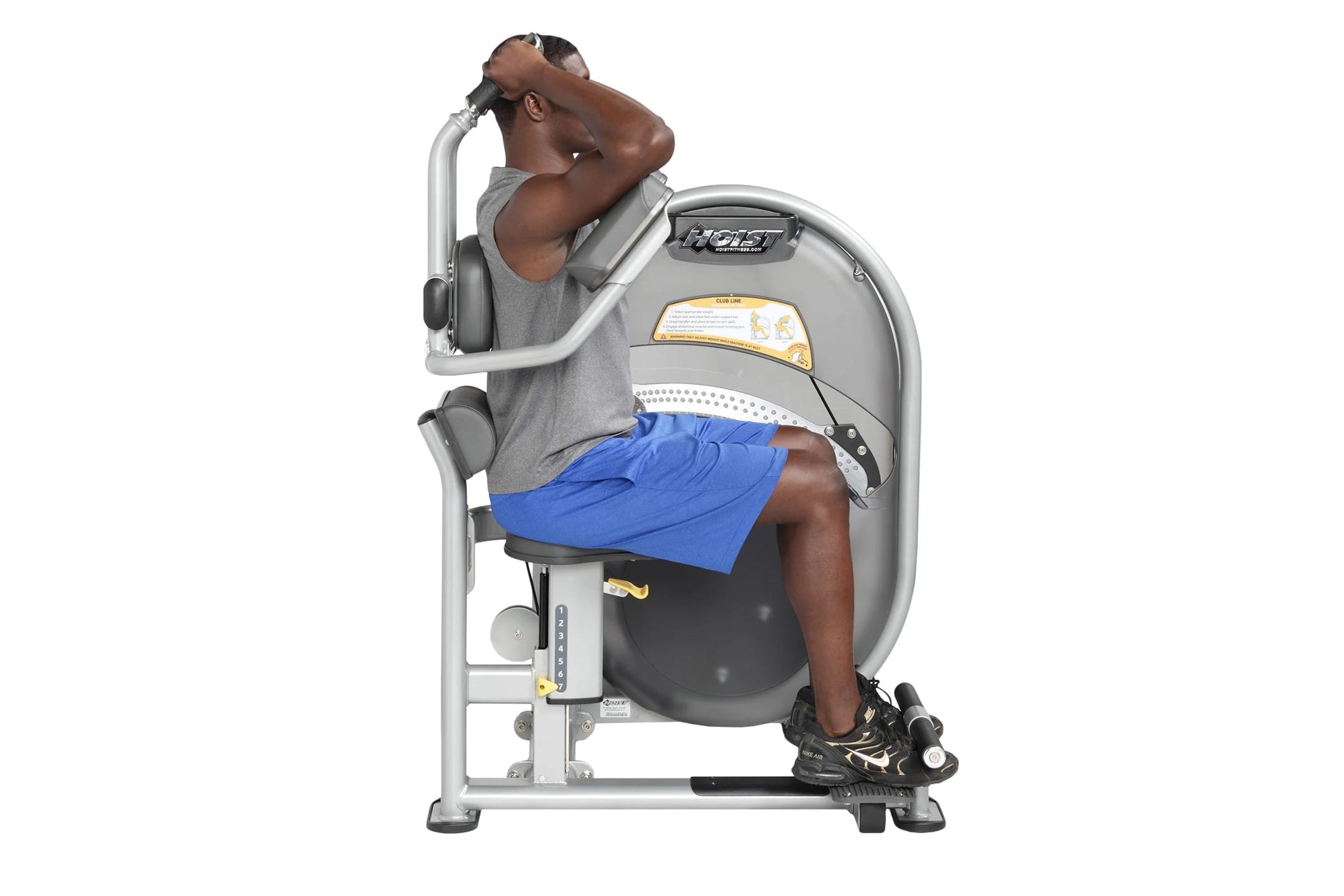 Hoist Club Line gray abdominal exercise machine with man in gray shirt and blue shorts demonstrating seated ab workout positi
