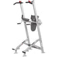 Silver and gray vertical leg press machine with black foot platforms, red handles, and wide base on white background