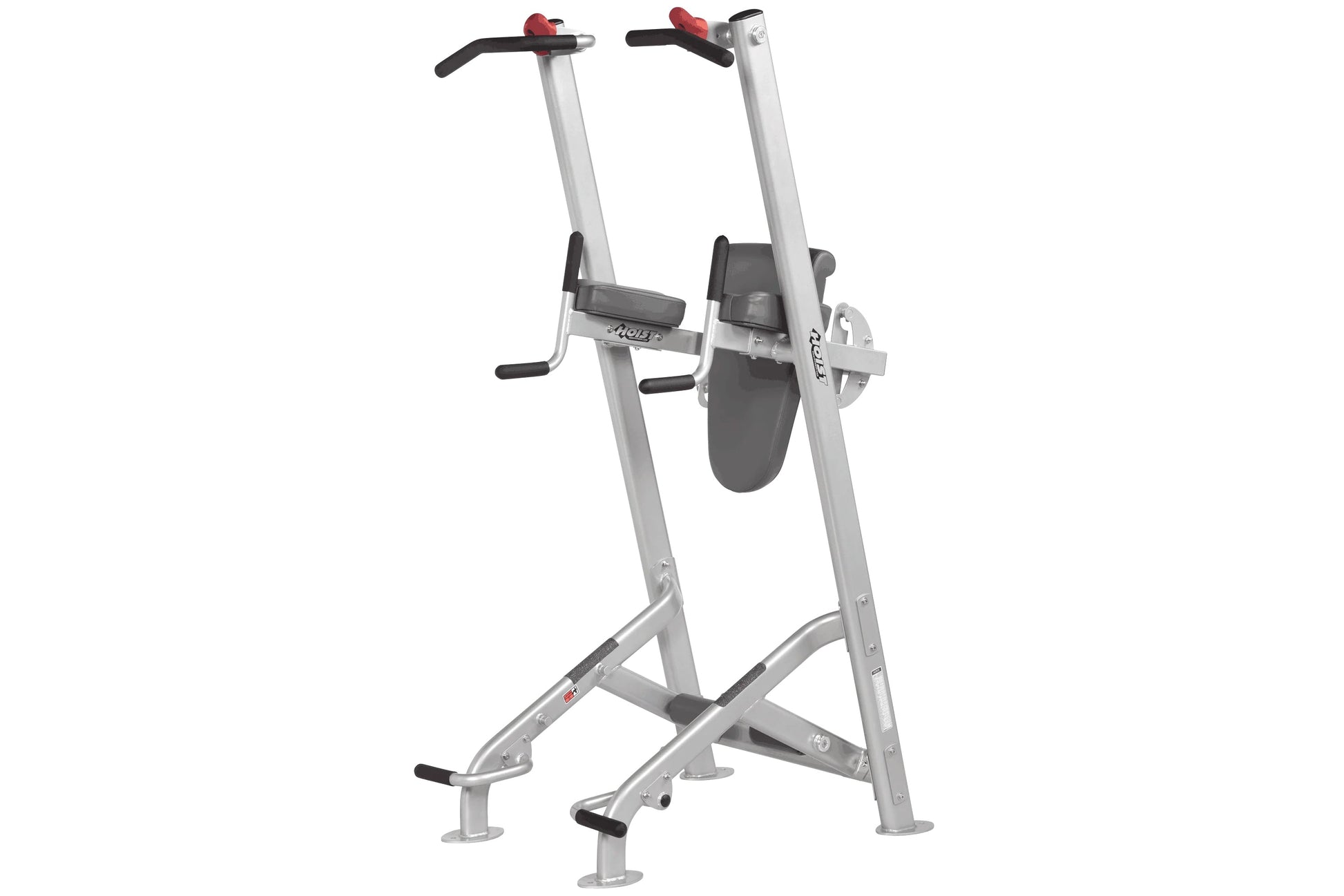 Silver and gray vertical leg press machine with black foot platforms, red handles, and wide base on white background