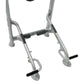 Silver metal home gym machine with black foam handlebars and foot pedals, flat lay on white background