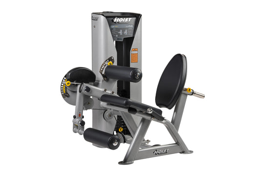 Hoist Dual Series silver and black leg extension and leg curl machine with yellow handles on white background