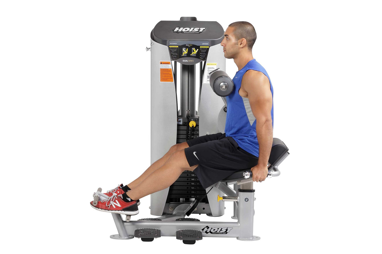 Hoist Dual Series ab crunch and low back exercise machine with man in blue tank top and black shorts performing seated ab cru