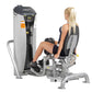 Hoist dual stack leg press machine with gray and black frame, shown in use by woman with blonde hair wearing black athletic t