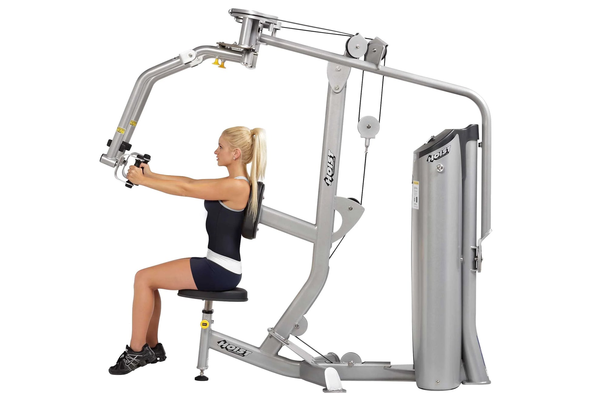 Woman using silver Hoist Pec Fly/Rear Delt exercise machine with adjustable arms and seat, demonstrating chest press position