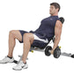 Man seated on navy and white folding weight bench performing dumbbell exercise with black weights, white sneakers on white ba