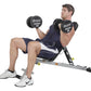 Man performing dumbbell chest press on gray Hoist Folding Multi-Bench with black 35-pound dumbbells, wearing navy shorts and 