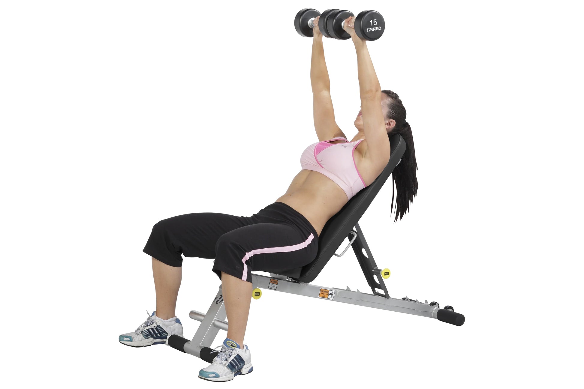 Woman performing dumbbell chest press on gray and black adjustable weight bench with 15kg dumbbells