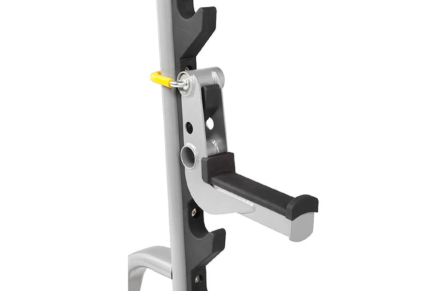Silver and black preacher curl attachment with yellow adjustment knob mounted on vertical post, shown on white background