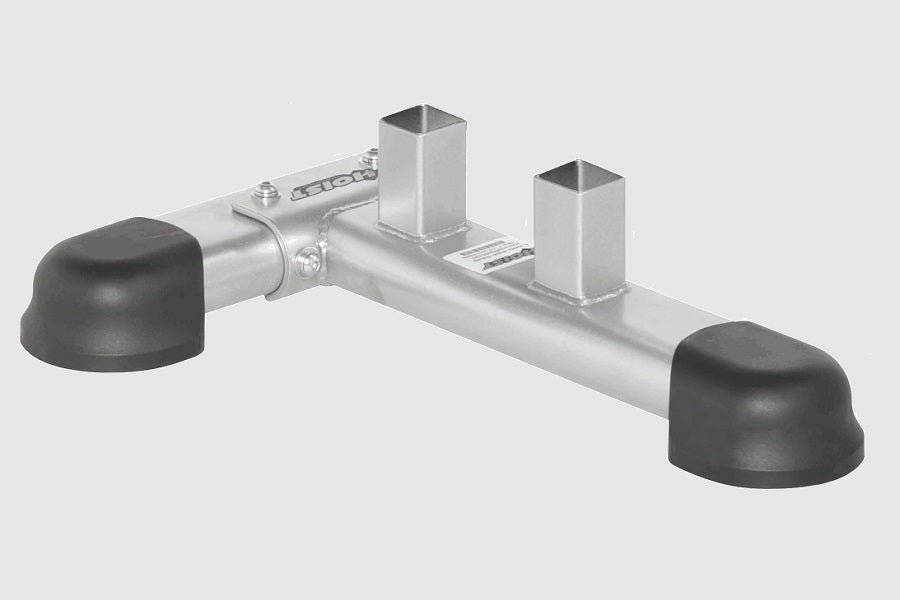 Hoist Safety Tiers Attachment with aluminum bar, two square metal posts, and black rubber feet on white background