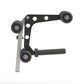 Hoist leg extension and curl attachment with black metal frame, white mounting holes, and three dark gray pulleys on white ba
