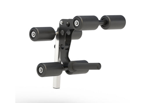 Black and gray leg extension and leg curl attachment with cylindrical rollers and white mounting post, on white background