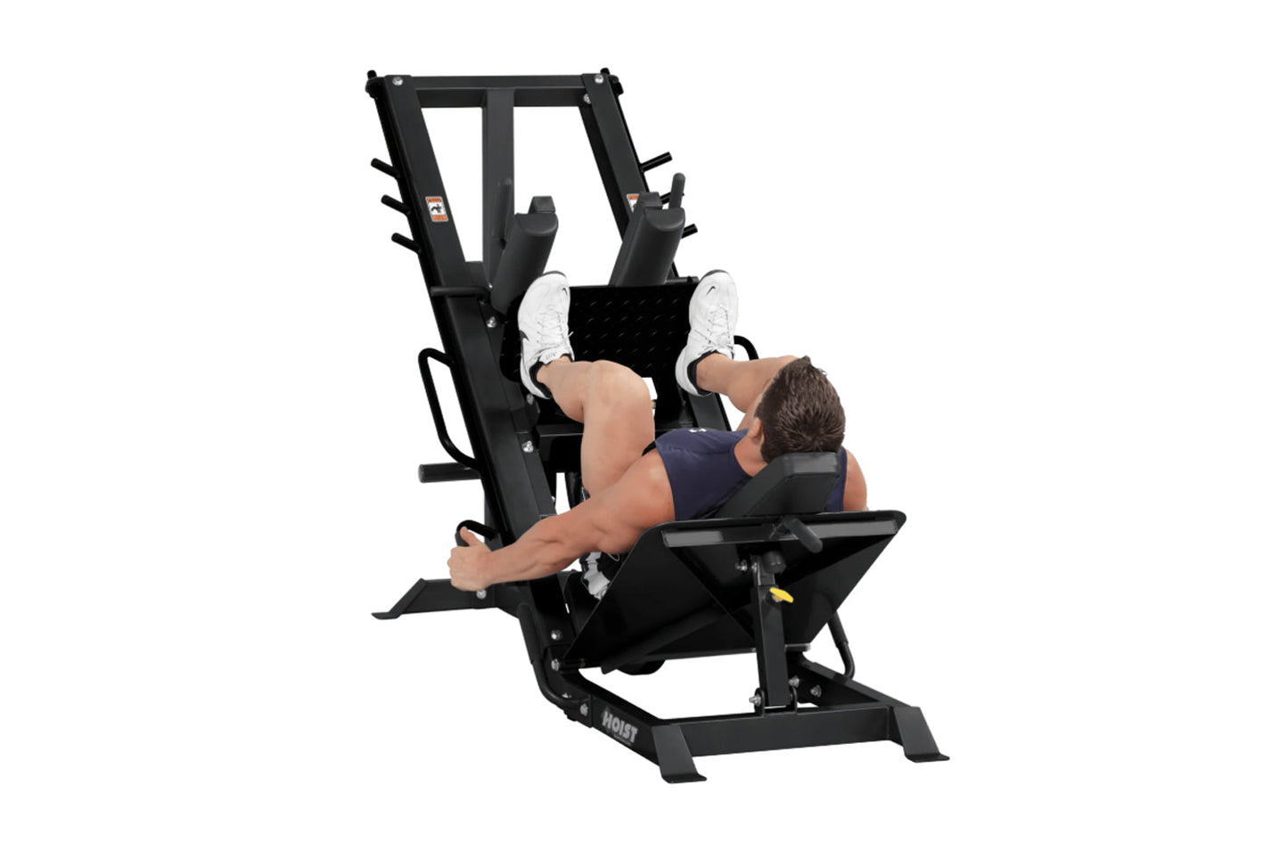 Black leg press and hack squat combo machine with padded seat and footplate, user demonstrating exercise position on white ba
