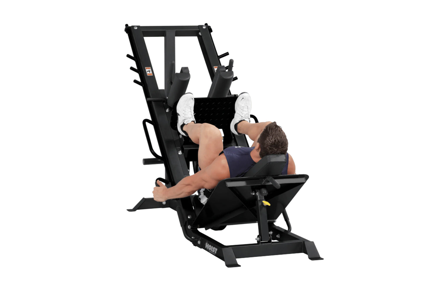 Black leg press and hack squat combo machine with padded seat and footplate, user demonstrating exercise position on white ba