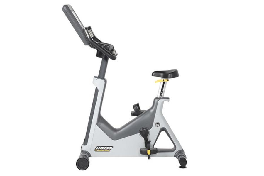 Hoist Lemond Series UT upright exercise bike with gray and white frame, black seat, and digital display console on white back