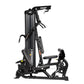 Black Hoist Mi1 multi-station home gym with cable machine, seat, and weight stack on white background