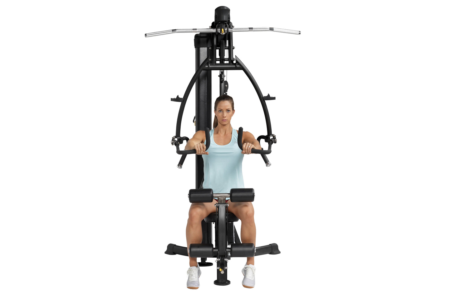 Black and silver home gym machine with chest press and leg press functions, model seated wearing light blue tank top and whit