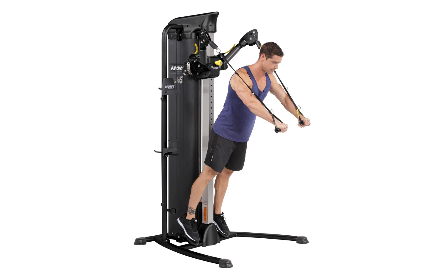 Man in blue tank top using black Hoist Mi5 functional trainer with dual cable pulleys on white background