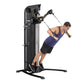 Black Hoist Mi5 functional trainer with cable machine system, demonstrated by man in navy tank top performing exercise with h
