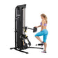 Hoist Mi5 functional trainer with black and silver frame, model shown with woman performing leg exercise on white background