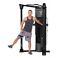 Hoist Mi6 black functional trainer home gym with male model demonstrating leg exercise using cable attachment