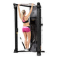 Black Hoist Mi6 functional trainer with model performing pull-up exercise on overhead bar