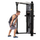 Hoist Mi6 Functional Trainer in black with gray accents, demonstrated by male model using cable attachment for exercise