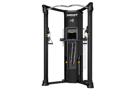 Hoist Mi6 functional trainer with black frame, dual cable towers, silver curved top bar, and yellow accents on white backgrou