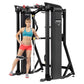 Black Hoist Mi7 functional training system with red adjustment knobs, worn by model in turquoise sports bra and coral shorts 