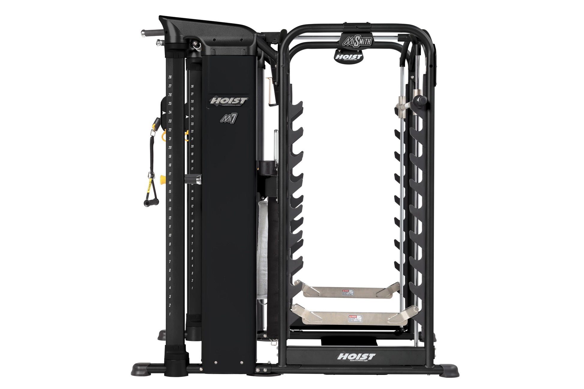 Black Hoist MI7 Smith machine with dual weight stacks, cable attachment arms, and foot platforms on white background