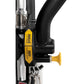 Black and silver functional trainer with yellow and black brakes labeled "rotate down to store" and "rotate down to use," sho