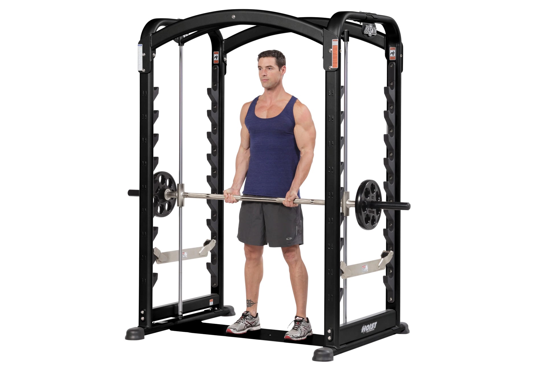 Hoist MiSmith Dual Action Smith Machine with male model demonstrating barbell exercise on white background