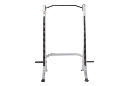 Hoist Multi-Purpose Squat Rack with silver uprights, black curved bar, and horizontal safety arms on white background