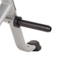 Silver and black stationary exercise bike seat and handlebars on white background