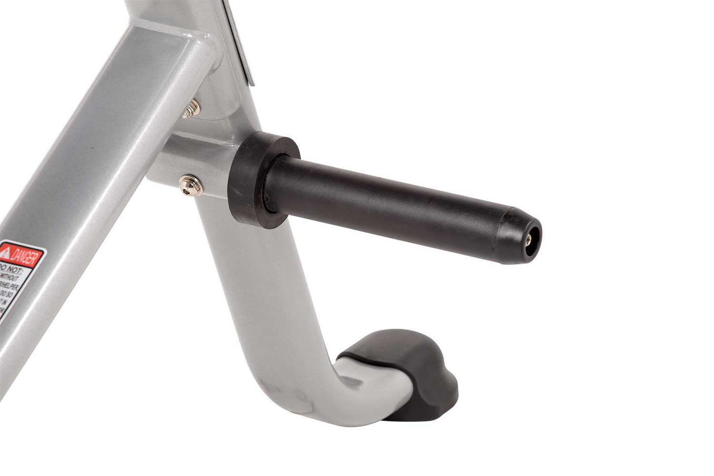Silver and black stationary exercise bike seat and handlebars on white background