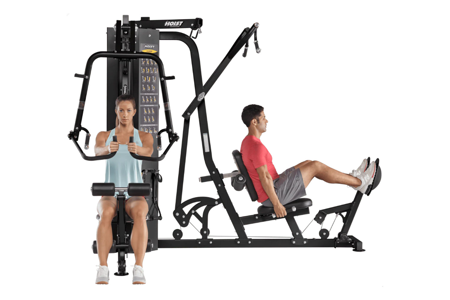 Hoist 2-Stack Multi Gym with woman using chest press station and man using leg press station, black frame on white background