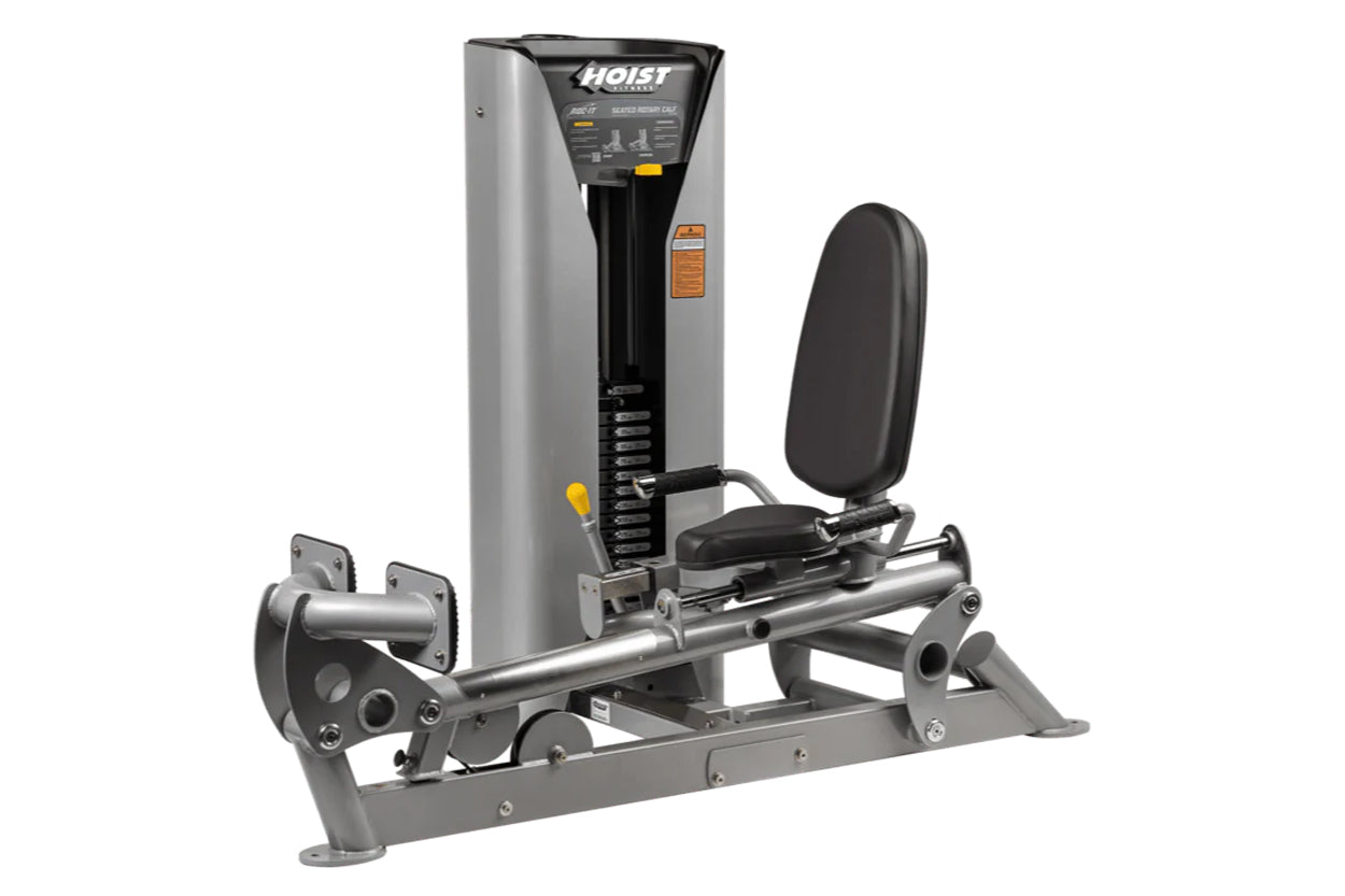 Hoist ROC-IT Rotary Calf Machine with gray and black frame, padded seat, and leg press platform on white background