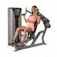 Woman in pink sports bra and shorts using Hoist ROC-IT shoulder press machine with gray and black frame on white background