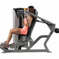 Hoist ROC-IT shoulder press machine with gray frame and black upholstery, woman in coral tank top demonstrating seated exerci