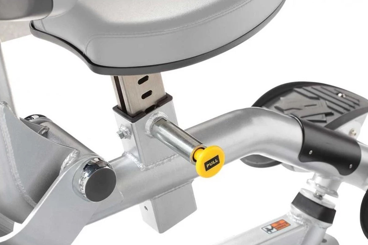 Hoist ROC-IT Triceps Extension Machine with silver frame, gray padded seat and armrests, yellow pull handle, on white backgro