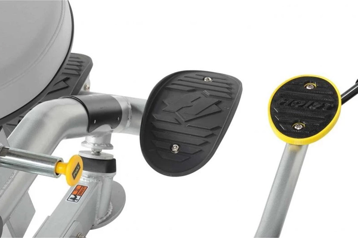 Hoist ROC-IT triceps extension machine with gray frame, black textured foot pedal, and yellow accents on white background