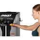 Woman in teal sports bra using Hoist ROC-IT black and silver lat pulldown machine with instruction panel