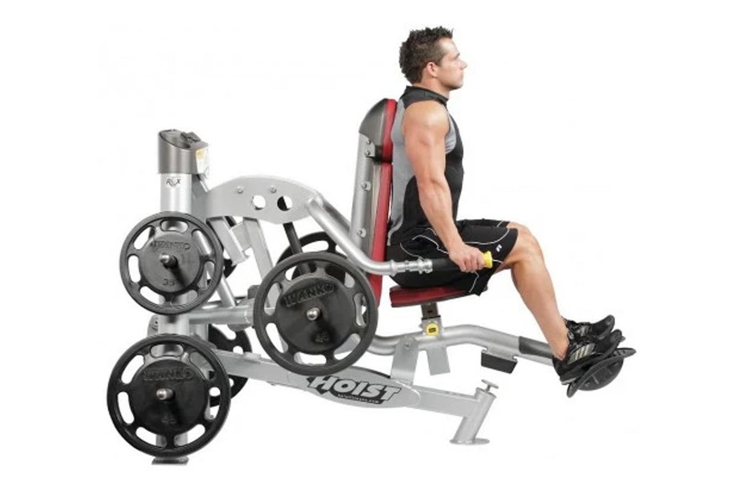 Hoist ROC-IT leg press machine with silver frame, black weight plates, and red padded seat, shown with male model demonstrati