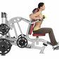 Man using silver and black leg press machine with weighted plates, demonstrating seated leg extension exercise