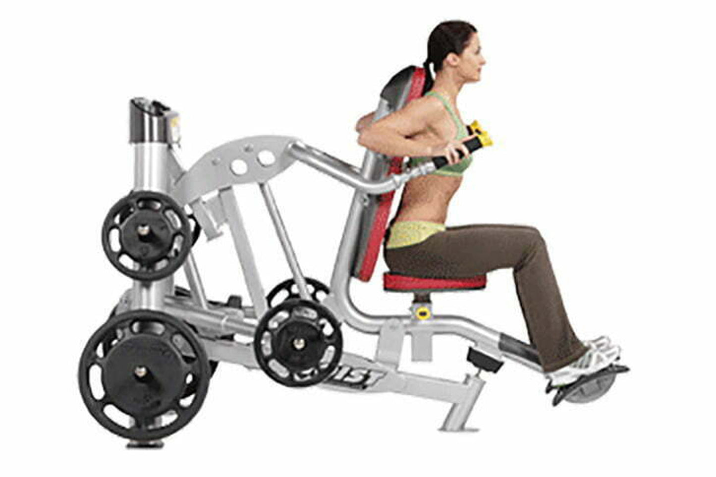 Man using silver and black leg press machine with weighted plates, demonstrating seated leg extension exercise