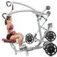 Silver and black lat pulldown machine with weight plates, woman in purple top demonstrating seated exercise on red seat with 