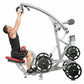 Man using silver and black lat pulldown machine with red seat, demonstrating upper body exercise form