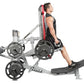 Man using silver and red Hoist ROC-IT hack squat machine with black weight plates, side profile view