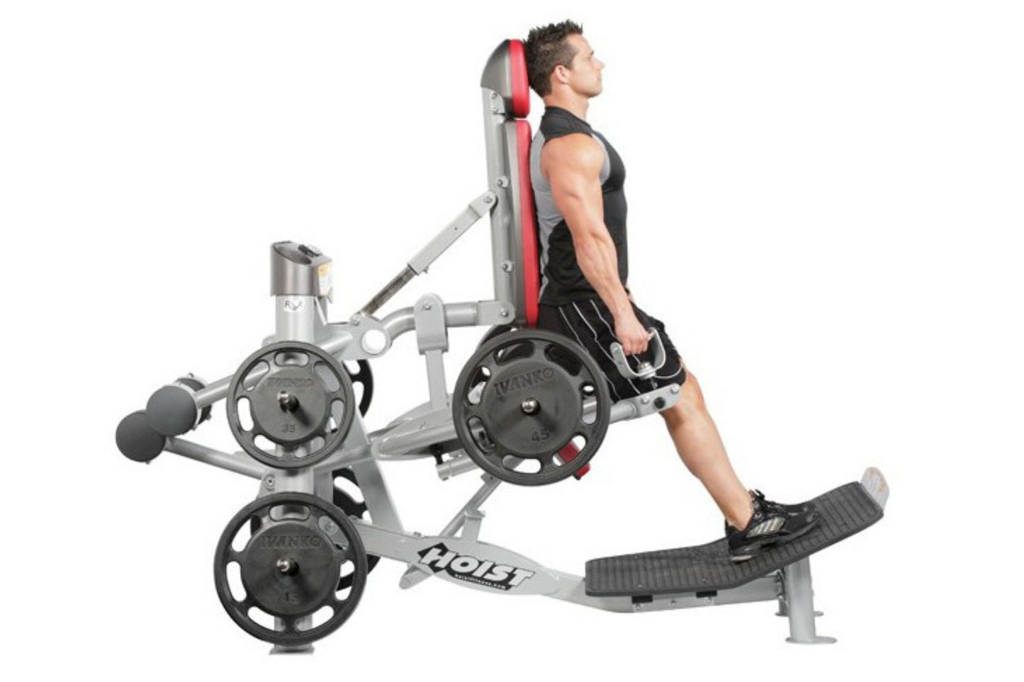 Man using silver and red Hoist ROC-IT hack squat machine with black weight plates, side profile view