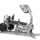 Hoist Dual Action Leg Press with gray and black frame, padded seat, dual footplates with weight plates, and upright monitor d