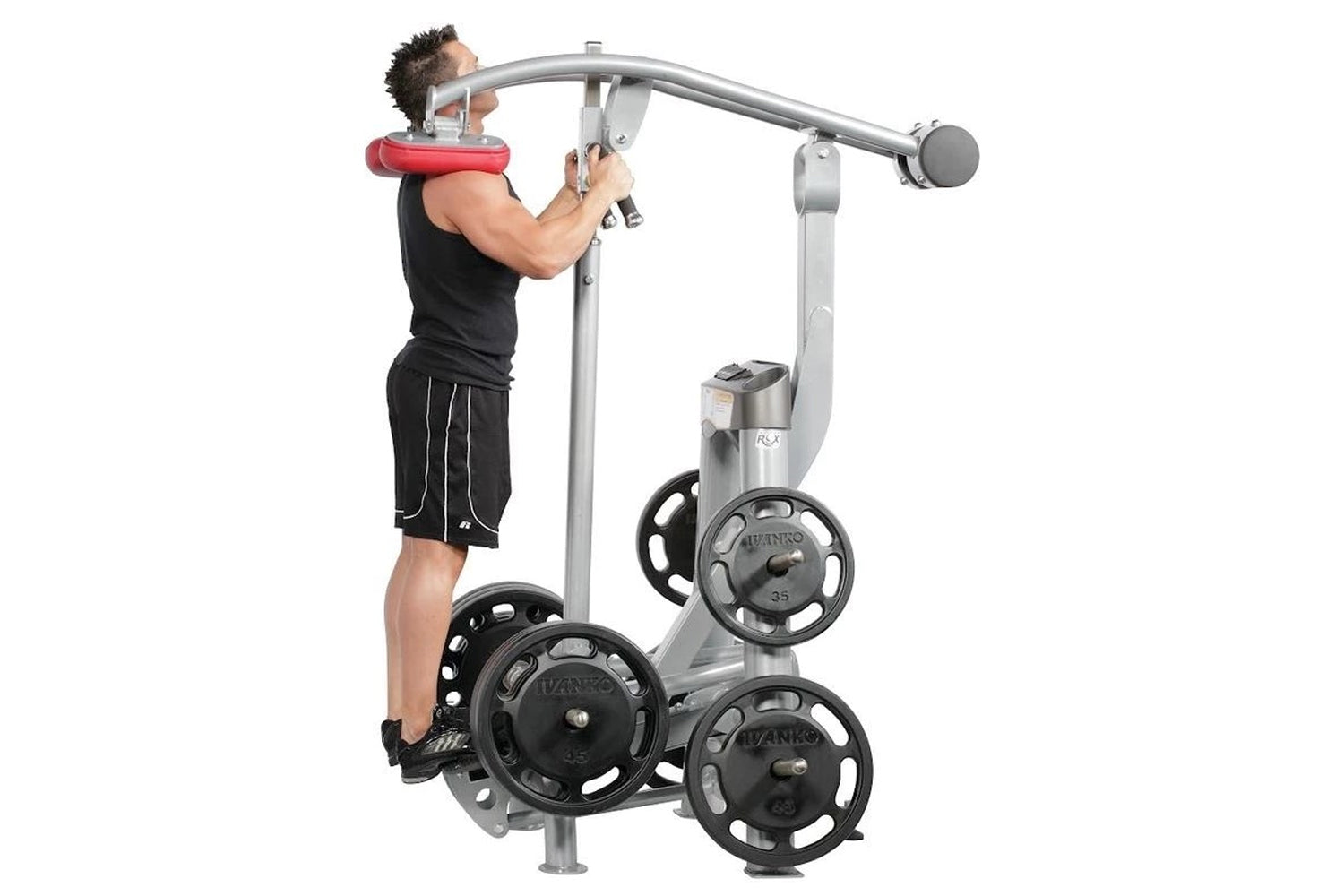 Man using silver and black standing calf raise machine with weighted plates, worn by model demonstrating exercise position